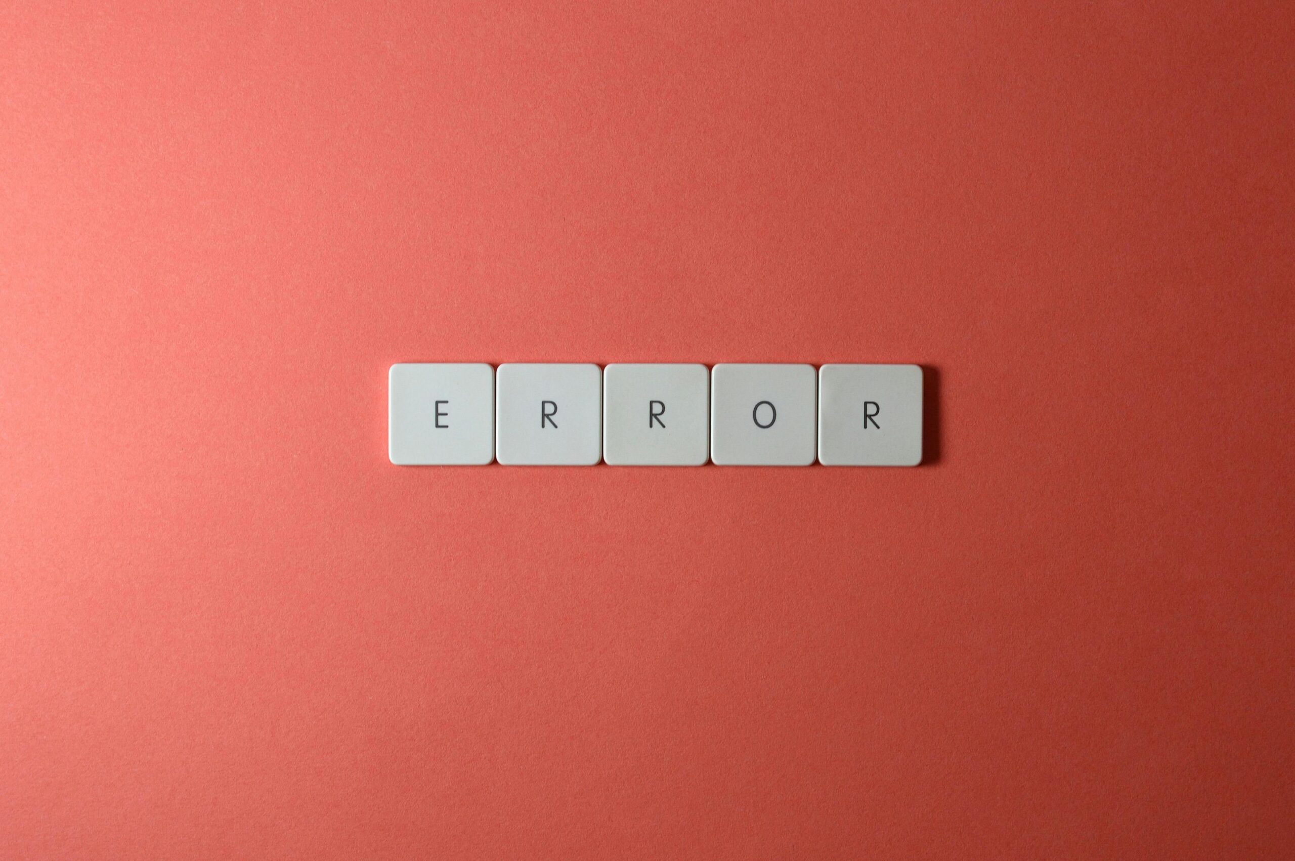 Close up shot of keyboard buttons spelling ERROR.