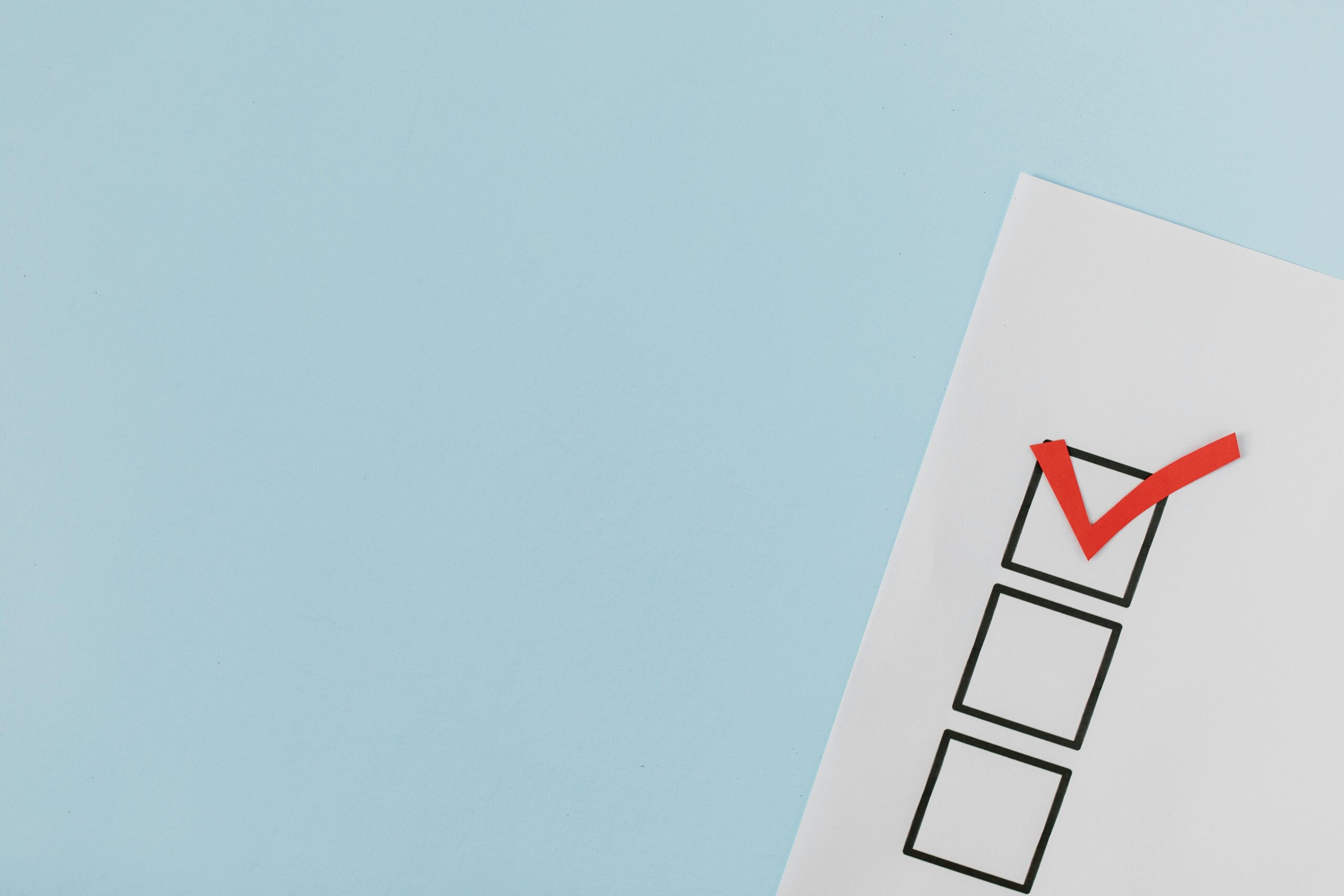 Red check mark on box in close-up view